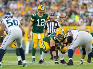 Will Aaron Rodgers be leading an up-tempo or no huddle offense in 2014? (Photo credit: Jeff Hanisch/USA Today).