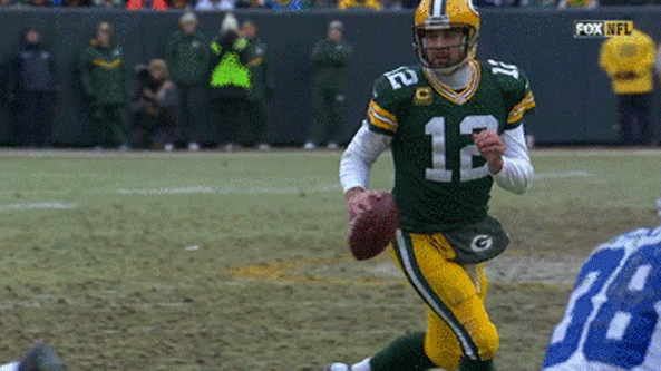 Aaron Rodgers fits TD pass to Richard Rodgers into tight window.