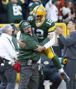 Mike McCarthy and Aaron Rodgers celebrate after a 72-yard touchdown to Tom Crabtree against the Arizona Cardinals.